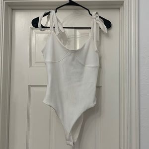never worn, tags on, white bodysuit